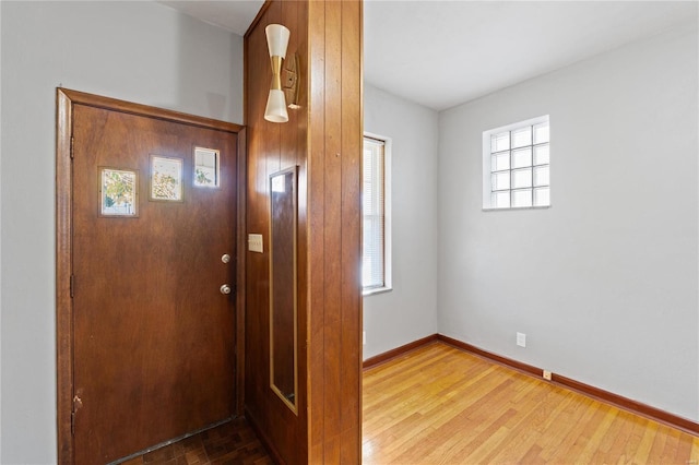 foyer entrance with a healthy amount of sunlight and wood-type flooring