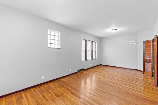 unfurnished room with light hardwood / wood-style flooring