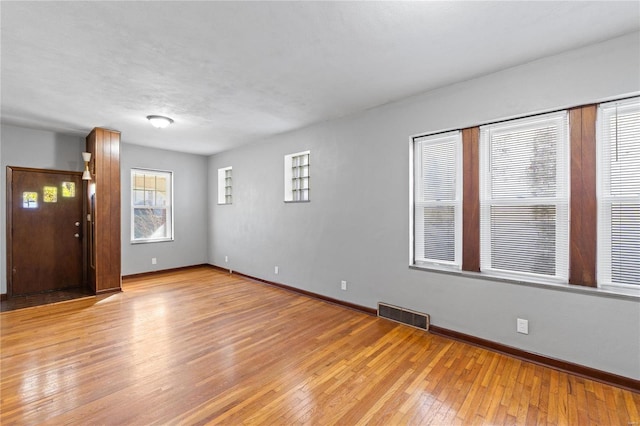 empty room with light wood-type flooring