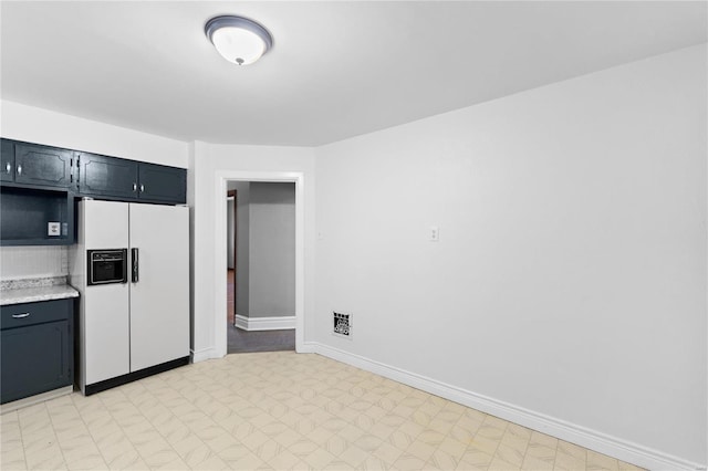 kitchen with white fridge with ice dispenser