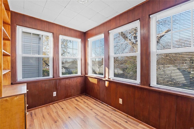 unfurnished sunroom with a healthy amount of sunlight