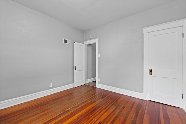 empty room featuring hardwood / wood-style flooring