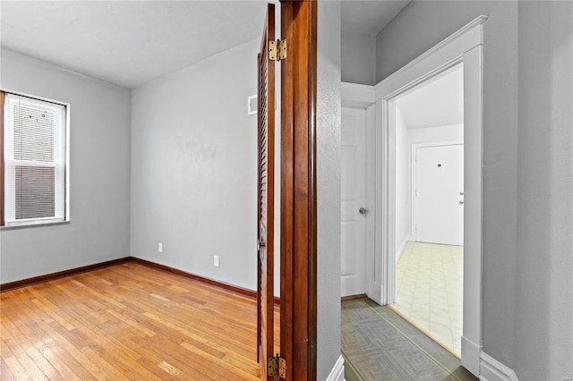 corridor featuring hardwood / wood-style floors