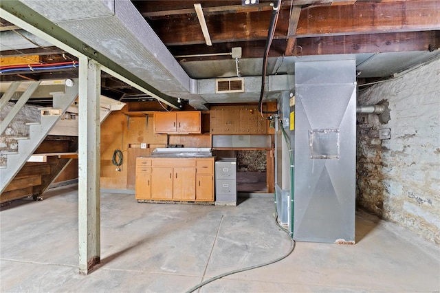 basement featuring heating unit