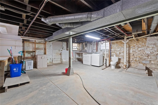 basement with separate washer and dryer