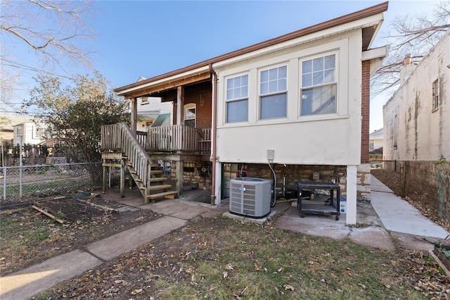 rear view of property with central air condition unit