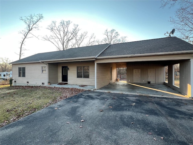 ranch-style home with a carport