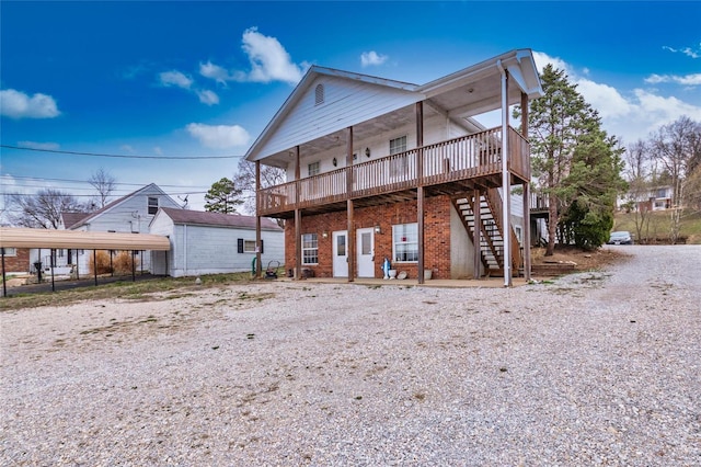 rear view of property featuring a carport