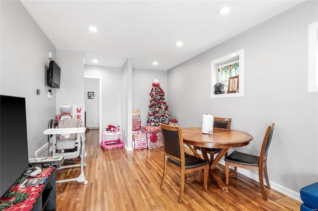 dining area featuring light wood-type flooring