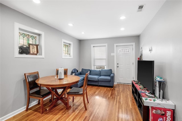 dining area featuring light wood-type flooring