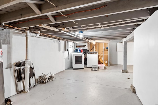 basement featuring washing machine and clothes dryer