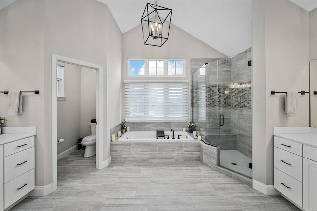 full bathroom with toilet, vanity, plus walk in shower, and lofted ceiling