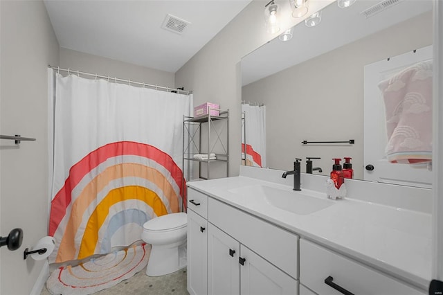 bathroom featuring toilet and vanity