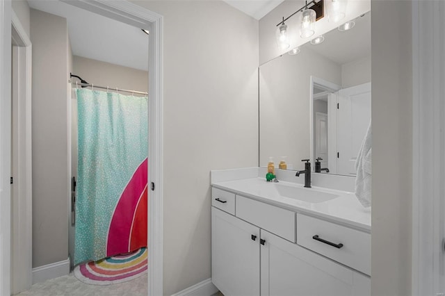 bathroom with a shower with shower curtain and vanity