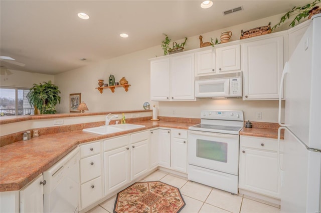 kitchen featuring white cabinetry, white appliances, and kitchen peninsula