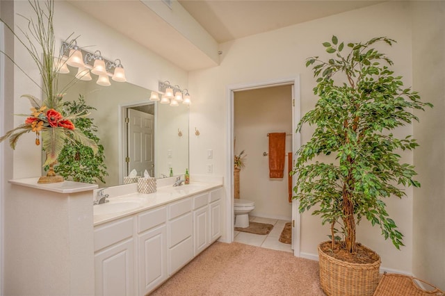 bathroom with tile patterned floors, vanity, toilet, and a notable chandelier