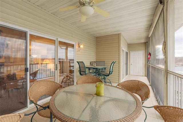 sunroom / solarium with ceiling fan and wood ceiling