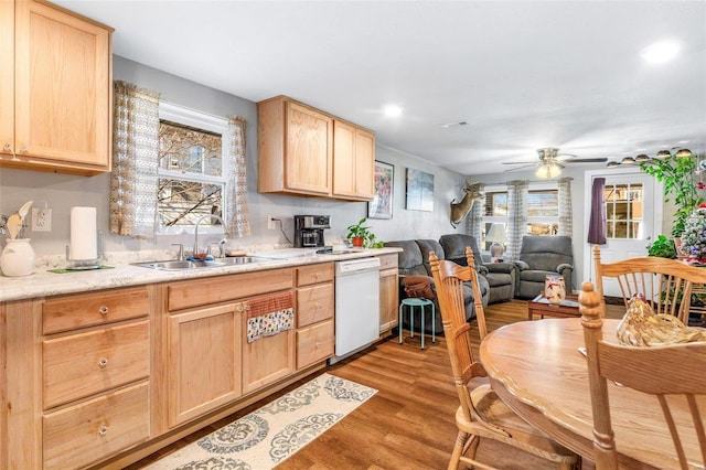 kitchen with ceiling fan, sink, light brown cabinets, dishwasher, and light hardwood / wood-style floors