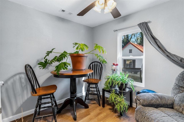 sitting room with ceiling fan and light wood-type flooring