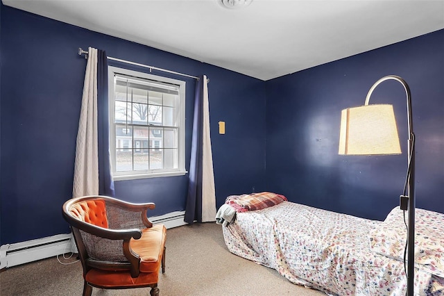 carpeted bedroom with a baseboard heating unit