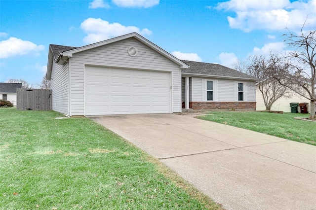 ranch-style house featuring a garage and a front yard