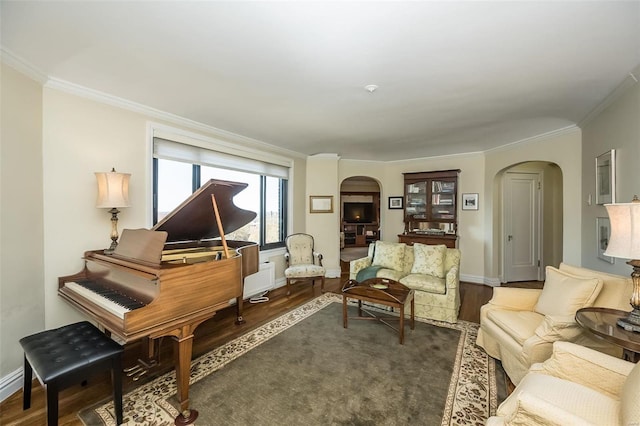 interior space featuring crown molding and dark hardwood / wood-style flooring