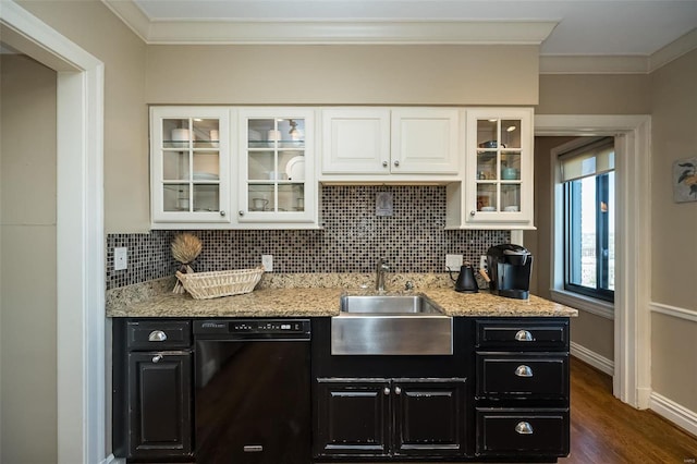 kitchen with light stone countertops, dark wood-type flooring, sink, black dishwasher, and white cabinetry