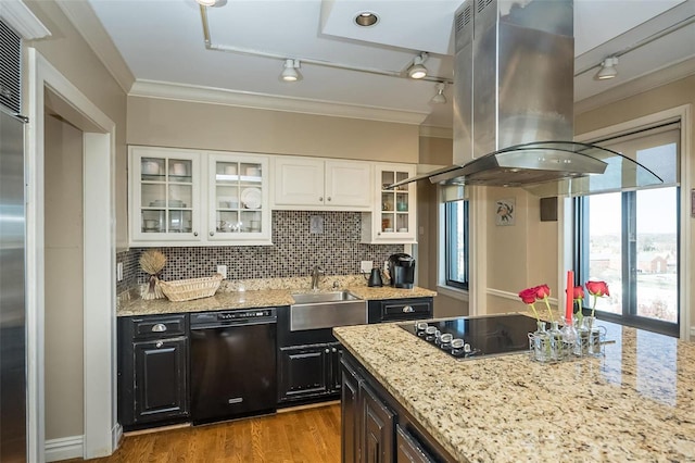 kitchen featuring track lighting, black appliances, white cabinets, crown molding, and island exhaust hood