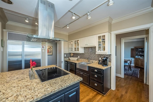 kitchen featuring dark hardwood / wood-style flooring, island range hood, sink, black appliances, and white cabinets