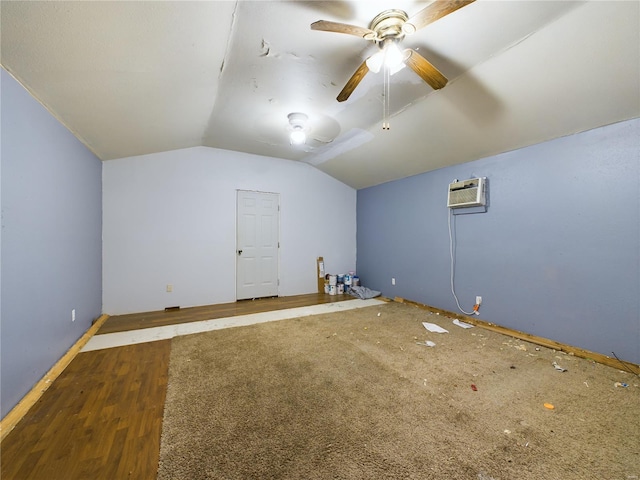 bonus room featuring a wall unit AC, ceiling fan, dark hardwood / wood-style flooring, and vaulted ceiling