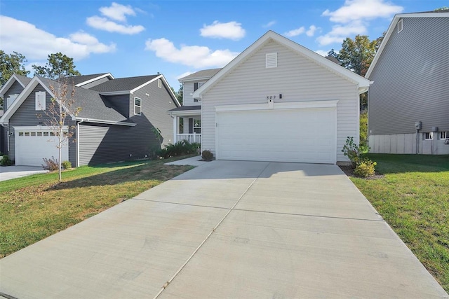 view of front of property featuring a front yard and a garage