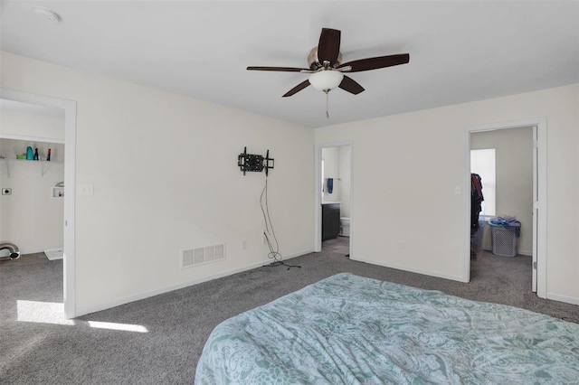 carpeted bedroom with connected bathroom and ceiling fan