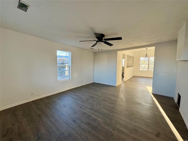 unfurnished room with ceiling fan and dark hardwood / wood-style flooring