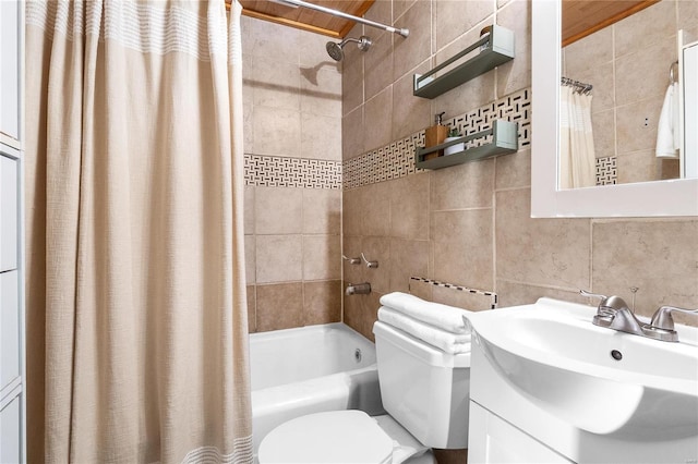 full bathroom with backsplash, tile walls, toilet, vanity, and shower / tub combo