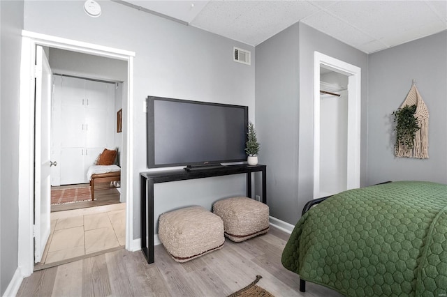 bedroom with light hardwood / wood-style floors