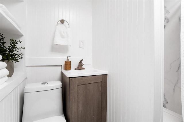 bathroom with vanity and toilet