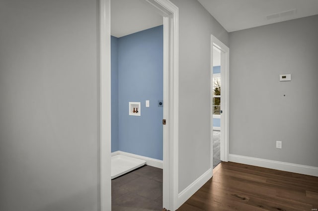 hallway featuring dark wood-type flooring