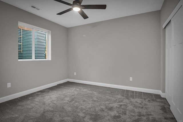 unfurnished bedroom featuring carpet floors, a closet, and ceiling fan