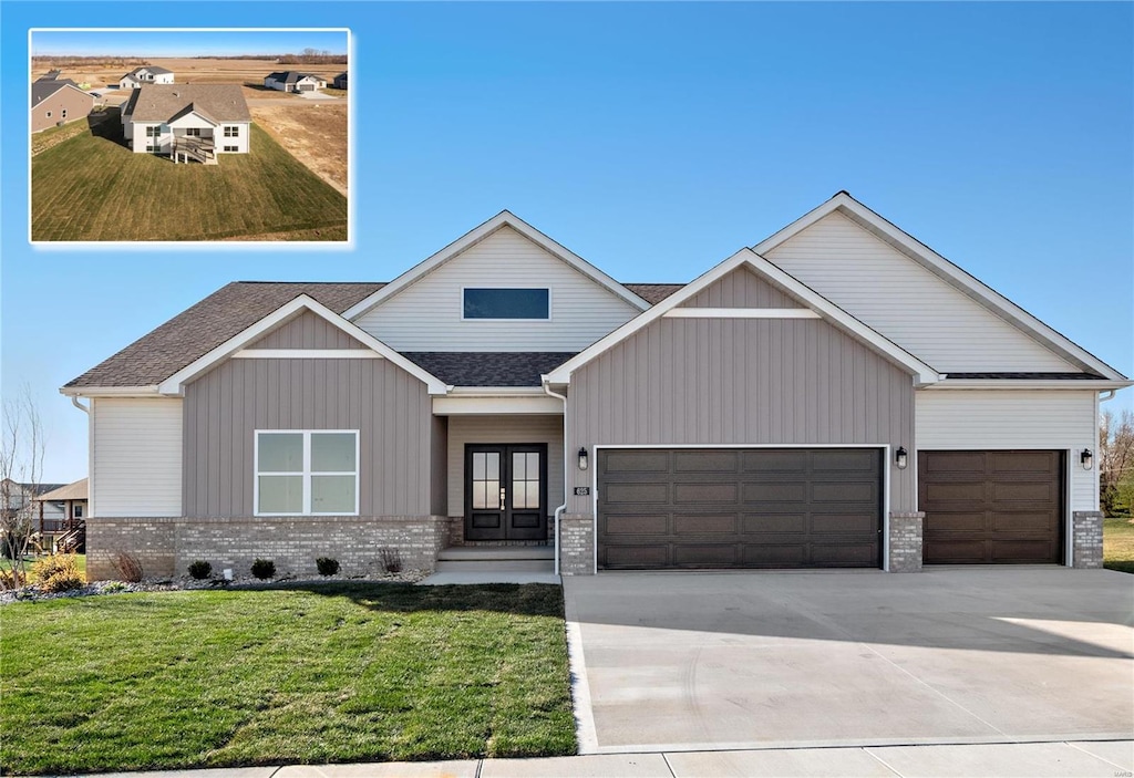 view of front of home featuring french doors and a front yard