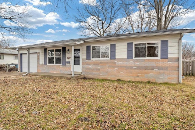 single story home featuring a garage