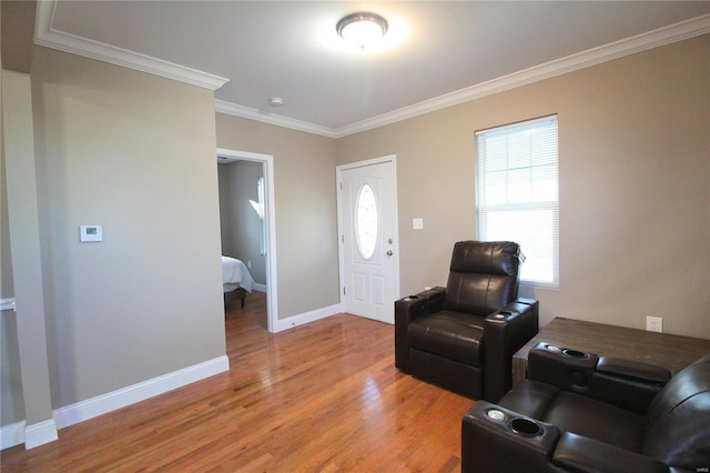 living room featuring ornamental molding and hardwood / wood-style flooring