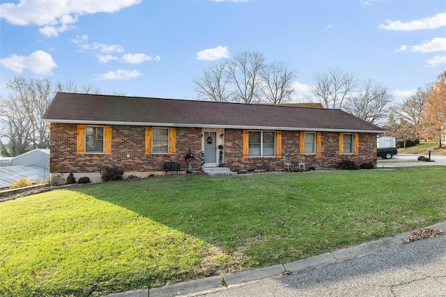 single story home featuring a front yard