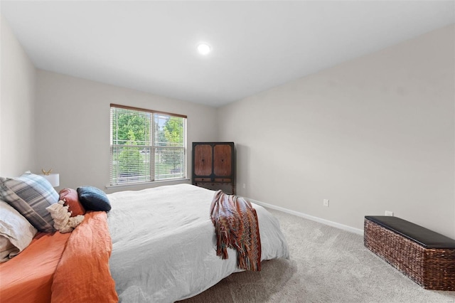 bedroom with light colored carpet