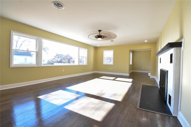 unfurnished room featuring ceiling fan and dark hardwood / wood-style flooring