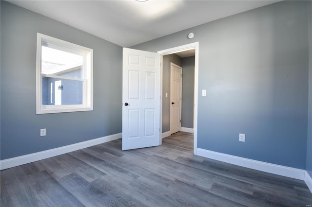 unfurnished room featuring wood-type flooring