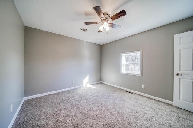 spare room with light carpet and ceiling fan