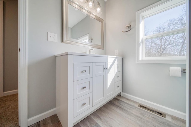 bathroom featuring wood-type flooring and vanity