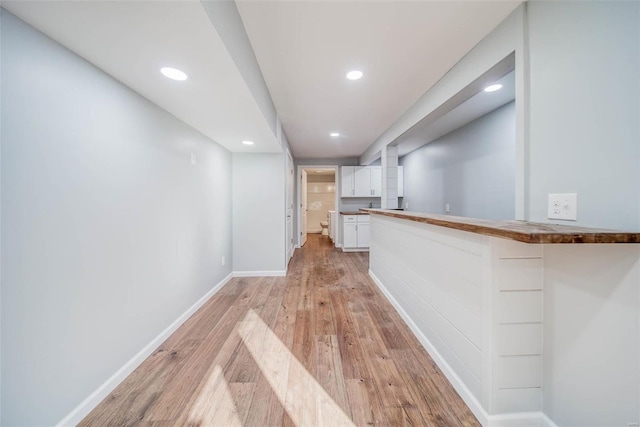 hallway featuring light hardwood / wood-style flooring