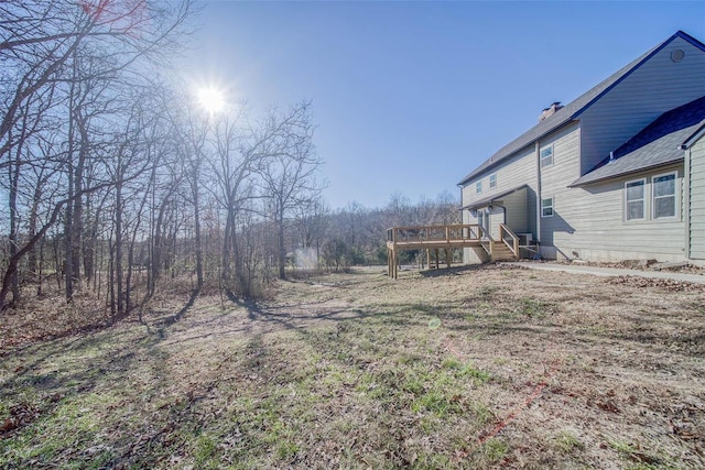 view of yard with a wooden deck