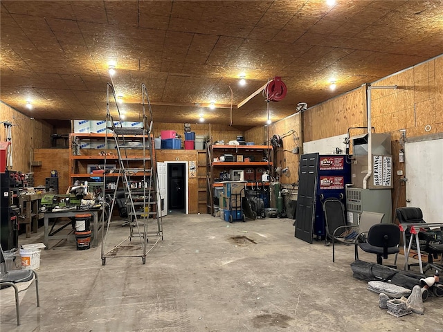 garage featuring wood walls